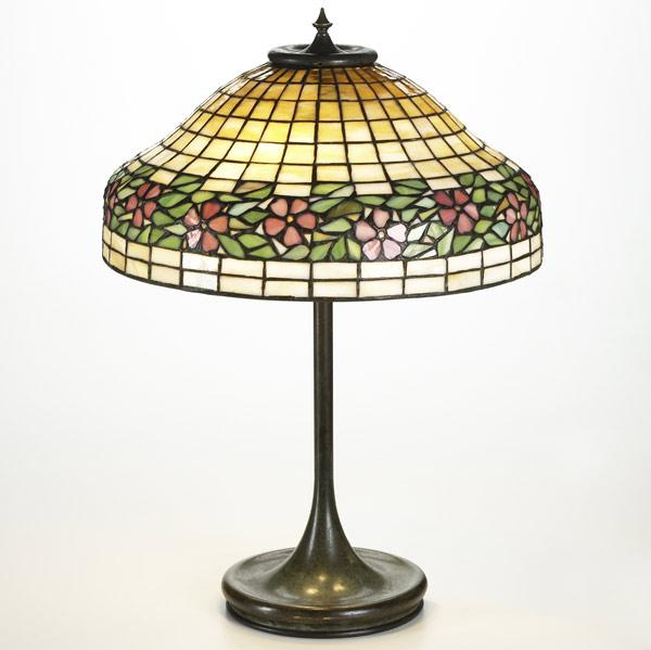 Appraisal: HANDELUNIQUETable lamp with floral shade on patinated baseUnmarked x