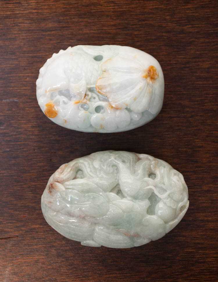 Appraisal: TWO CARVED JADEITE HAND-PIECES one depicting a fish swimming beside