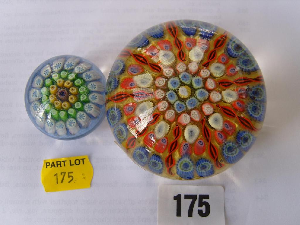 Appraisal: A Millefiori glass paperweight with red blue and white canes