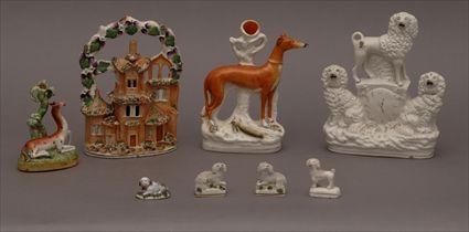 Appraisal: FIVE STAFFORDSHIRE TABLE DECORATIONS AND THREE PORCELAIN DOGS Comprising a