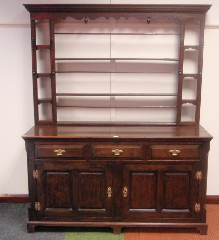 Appraisal: A Georgian and later oak dresser with plate rack top