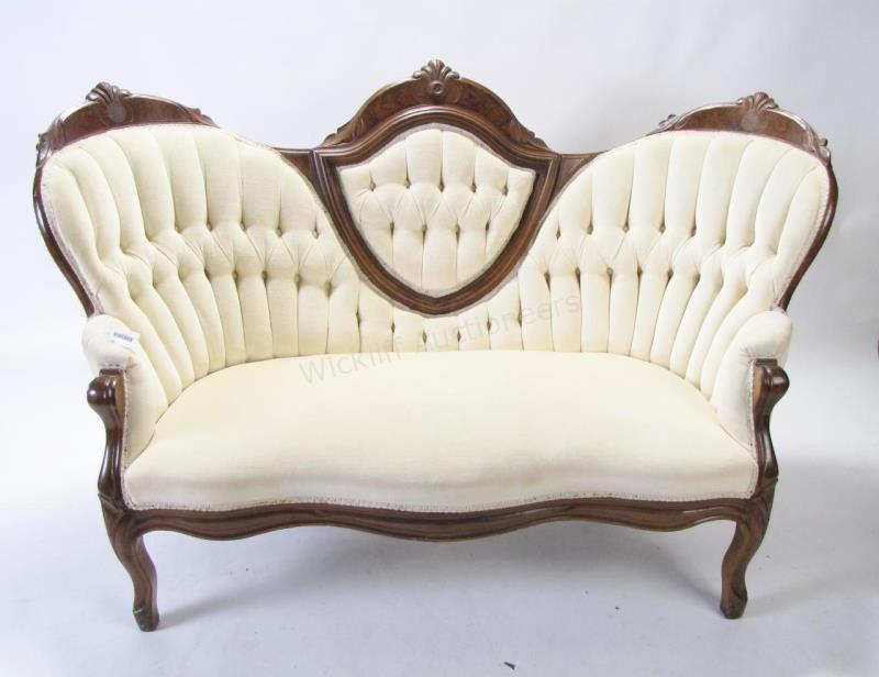 Appraisal: A Victorian style carved frame settee with medallion back button-tufted