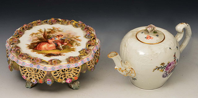 Appraisal: A MEISSEN PORCELAIN TEAPOT AND COVER with gilded scroll handle