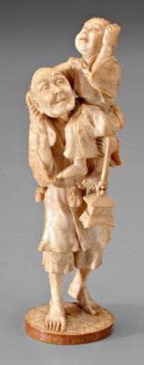 Appraisal: Japanese ivory okimono finely rendered elderly man holding child on