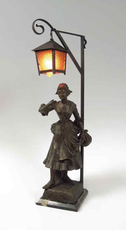 Appraisal: FRENCH FIGURAL SPELTER LAMP Maiden under a street light holding