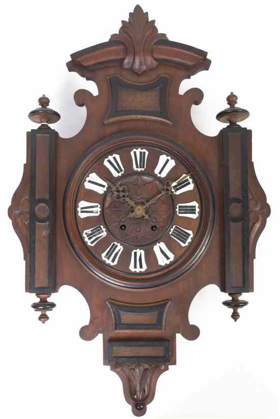 Appraisal: A French Victorian Parcel Ebonized Walnut Clock having a shaped