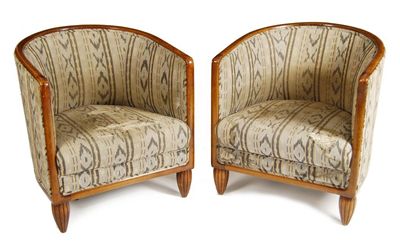 Appraisal: A pair of Art Deco tub chairs on carved bombe