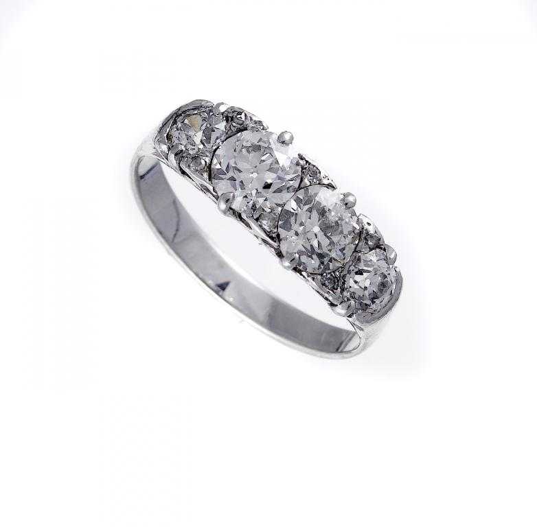 Appraisal: A DIAMOND FOUR STONE RING further set with smaller diamonds