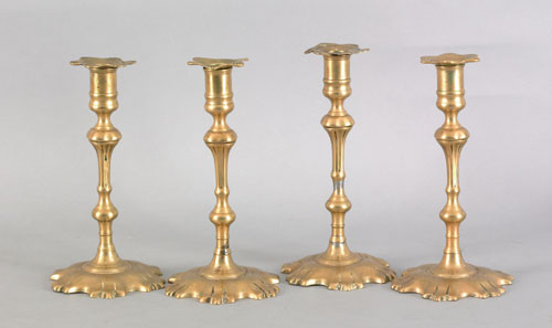 Appraisal: Four nearly identical Queen Anne brass candlesticks ca each with