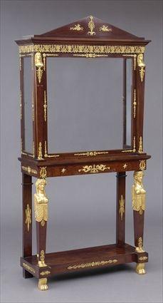 Appraisal: EMPIRE-STYLE GILT-BRONZE MOUNTED MAHOGANY VITRINE CABINET ON STAND The pedimented