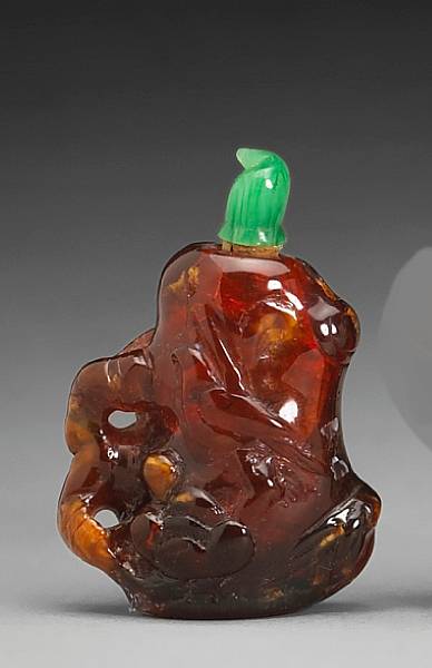 Appraisal: A carved amber snuff bottle th Century Rendered as a