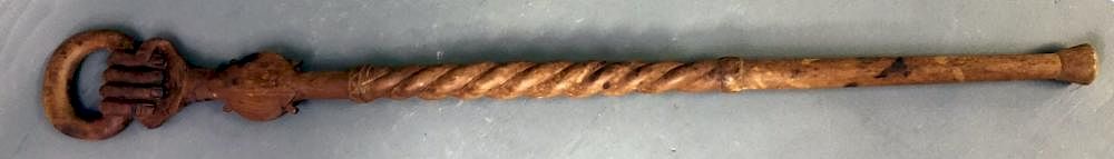 Appraisal: Carved Hand Cane Carved hand cane with rope twist decoration