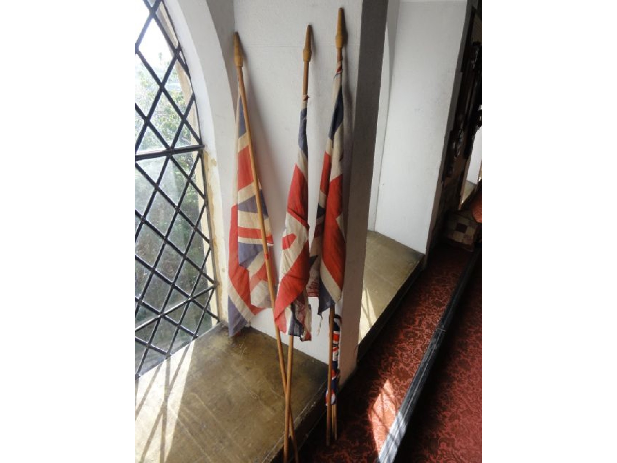 Appraisal: Three vintage Union Jack flags mounted on poles together with