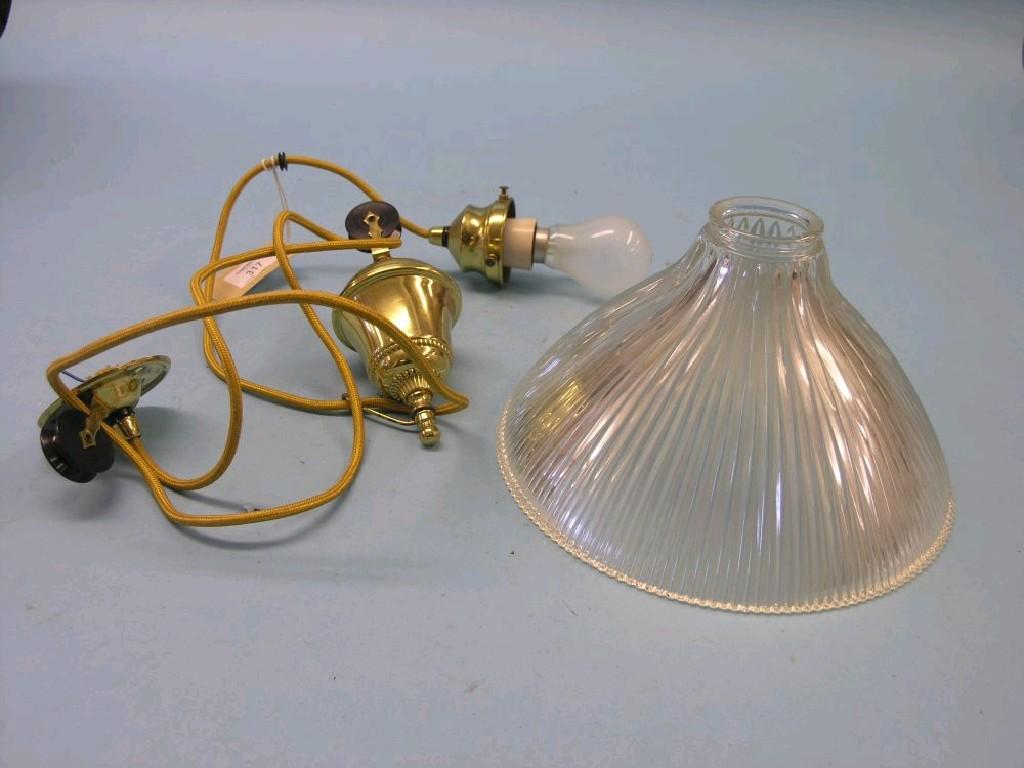 Appraisal: A brass ceiling light with pulley-adjustment glass shade