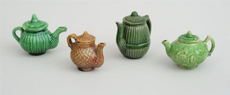 Appraisal: GROUP OF FOUR MINIATURE GLAZED POTTERY TEA AND COFFEE POTS