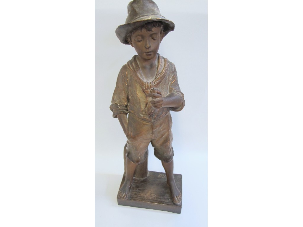 Appraisal: Large patinated plaster advertising figure of a boy