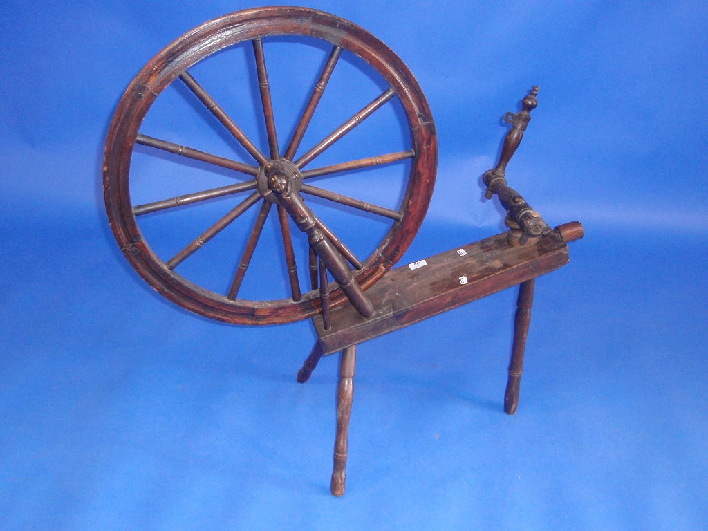 Appraisal: A th century beech and elm spinning wheel