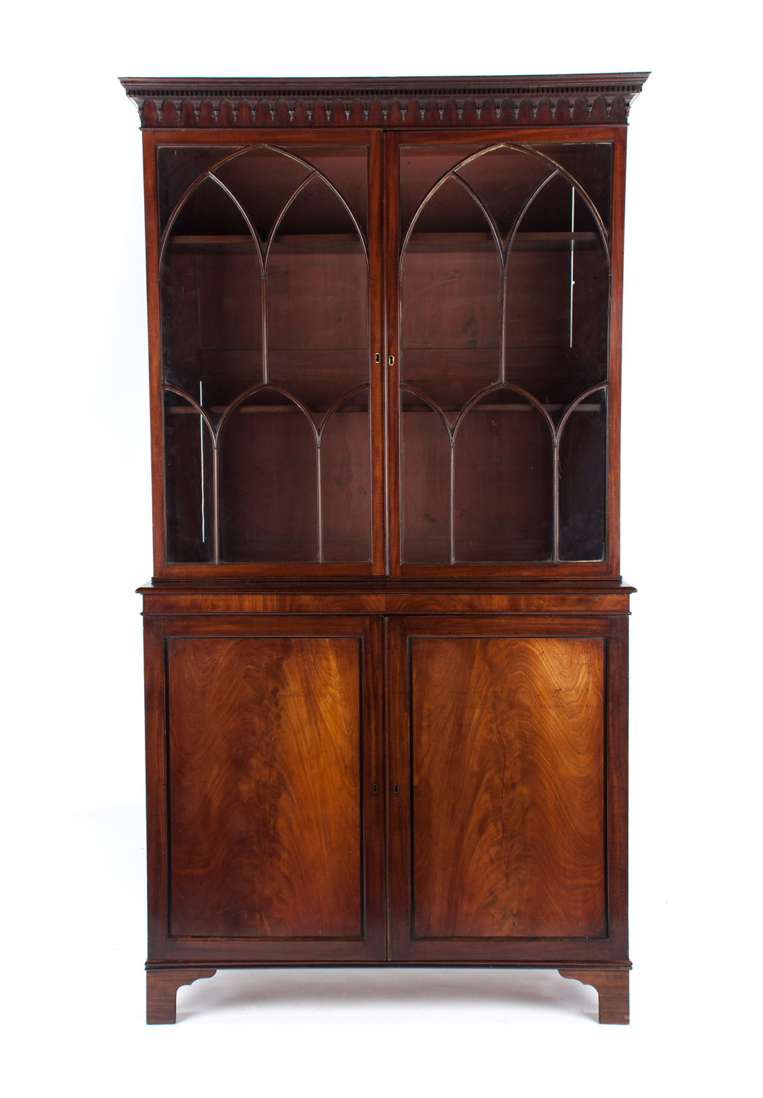 Appraisal: Gothic Chippendale style mahogany bookcase th century flat dentil-molded cornice