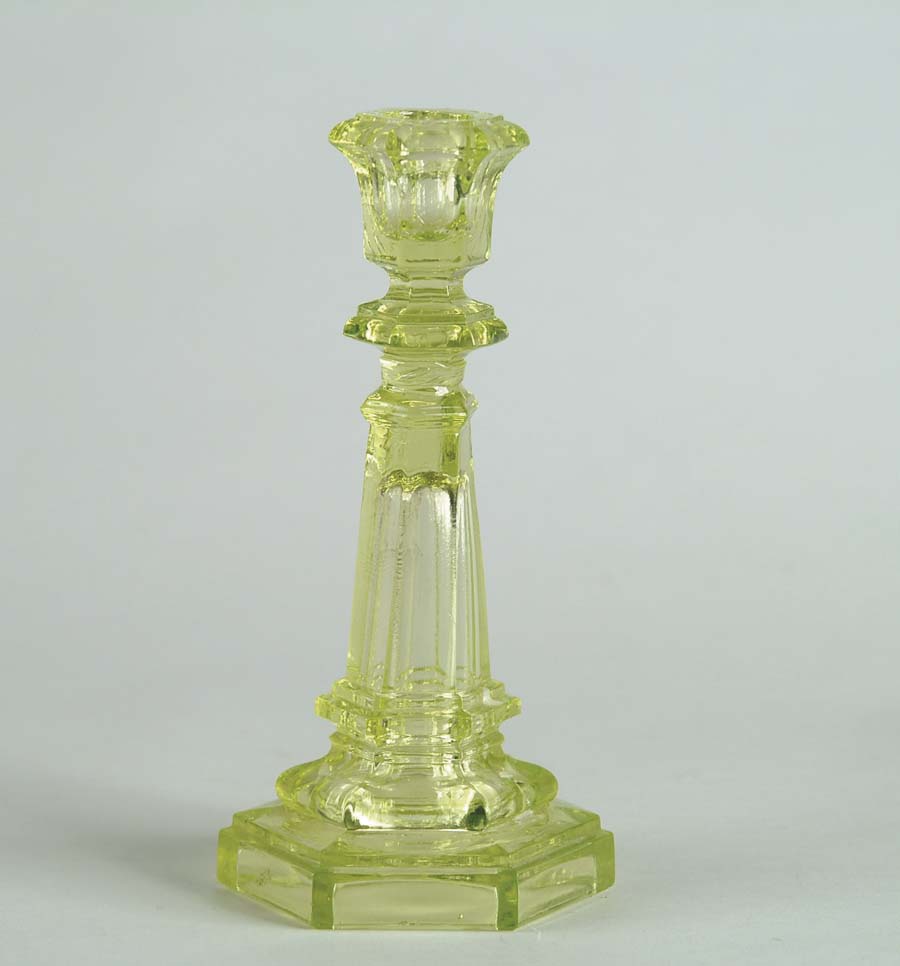 Appraisal: TWO YELLOW SANDWICH GLASS CANDLESTICKS One - with hex base