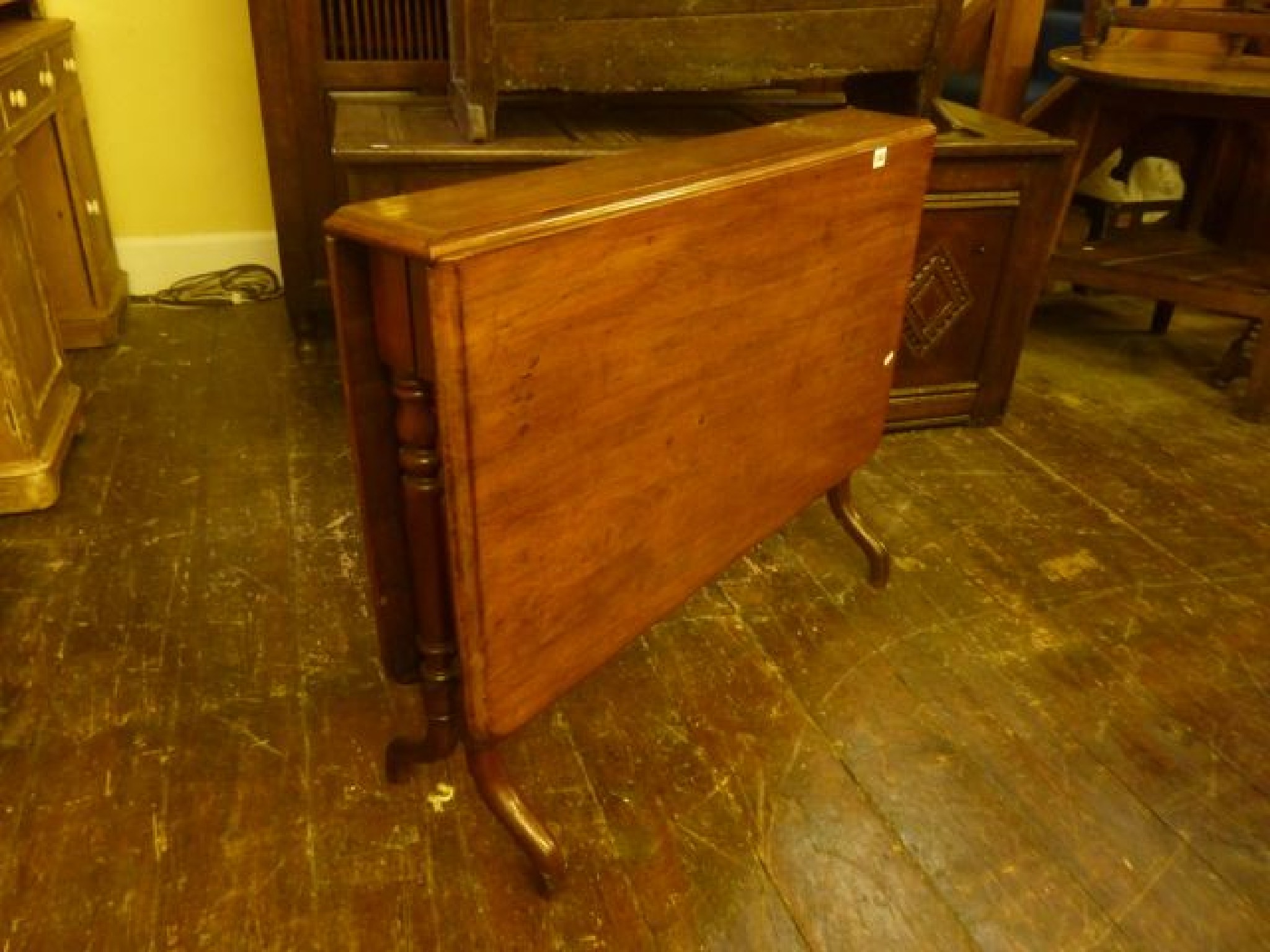 Appraisal: A Victorian mahogany drop leaf Sutherland table the top with