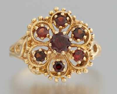 Appraisal: A Ladies' Gold and Garnet Ring k yellow gold ring