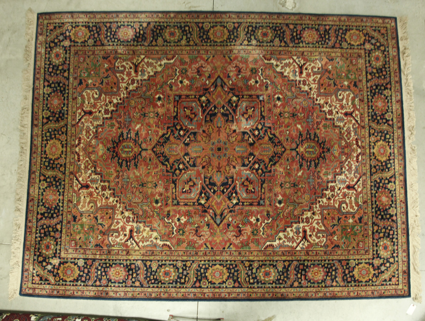 Appraisal: ROOMSIZE ORIENTAL RUG Twentieth century Geometric pattern in salmon yellow