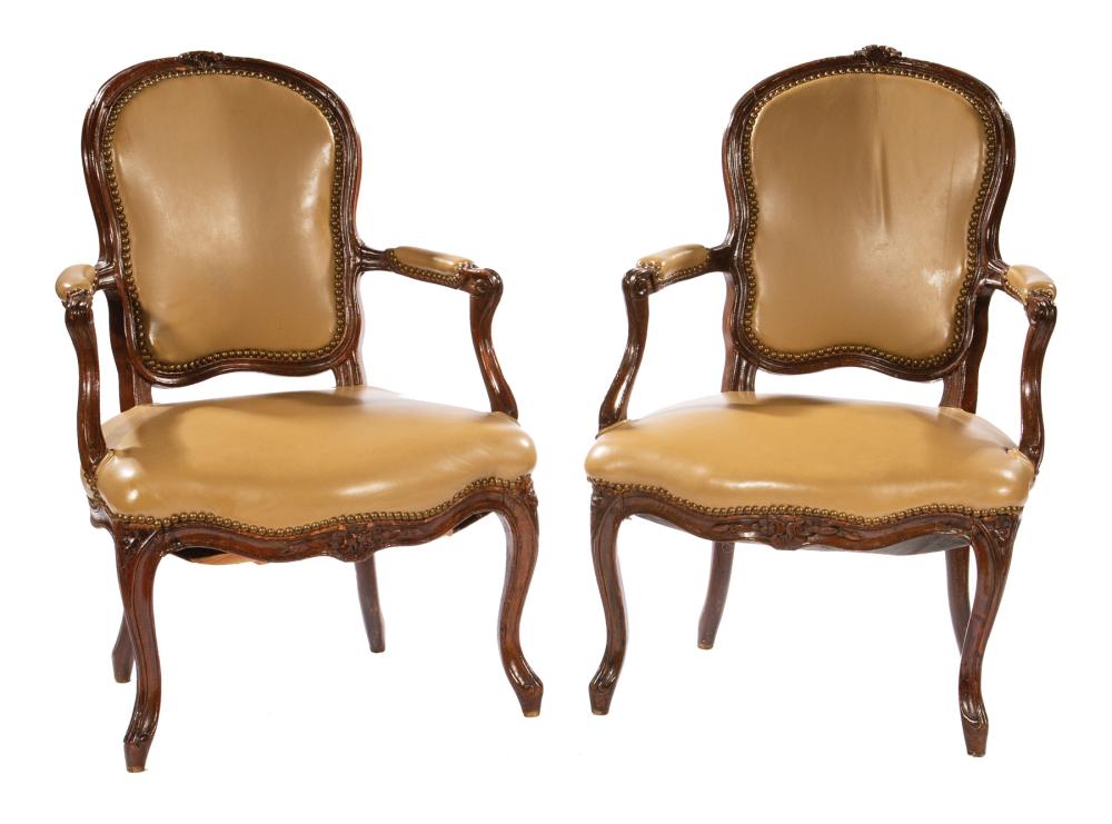 Appraisal: Pair of Antique Louis XV-Style Fruitwood Fauteuils floral carved crest