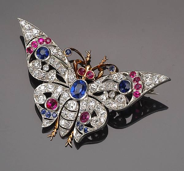 Appraisal: A diamond and gemstone brooch in the form of a