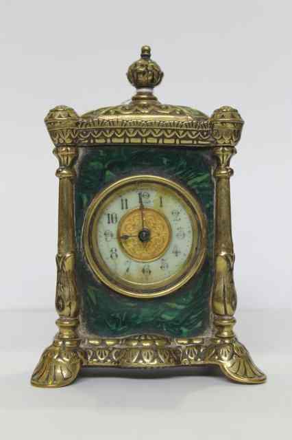 Appraisal: A TH CENTURY BRASS MOUNTED MANTEL CLOCK of stylised form