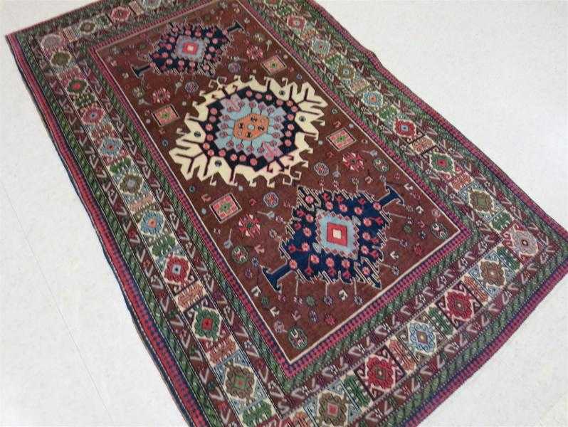 Appraisal: SEMI-ANTIQUE PERSIAN AREA RUG three geometric medallion design on reddish-brown