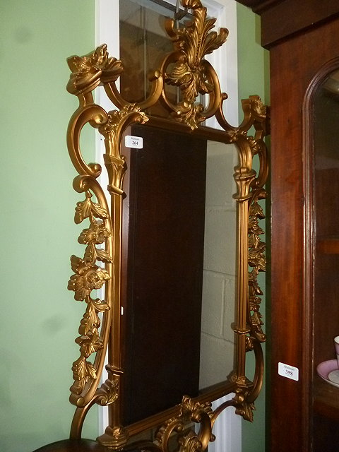 Appraisal: A GILT FRAMED GEORGIAN STYLE WALL MIRROR with acanthus leaf