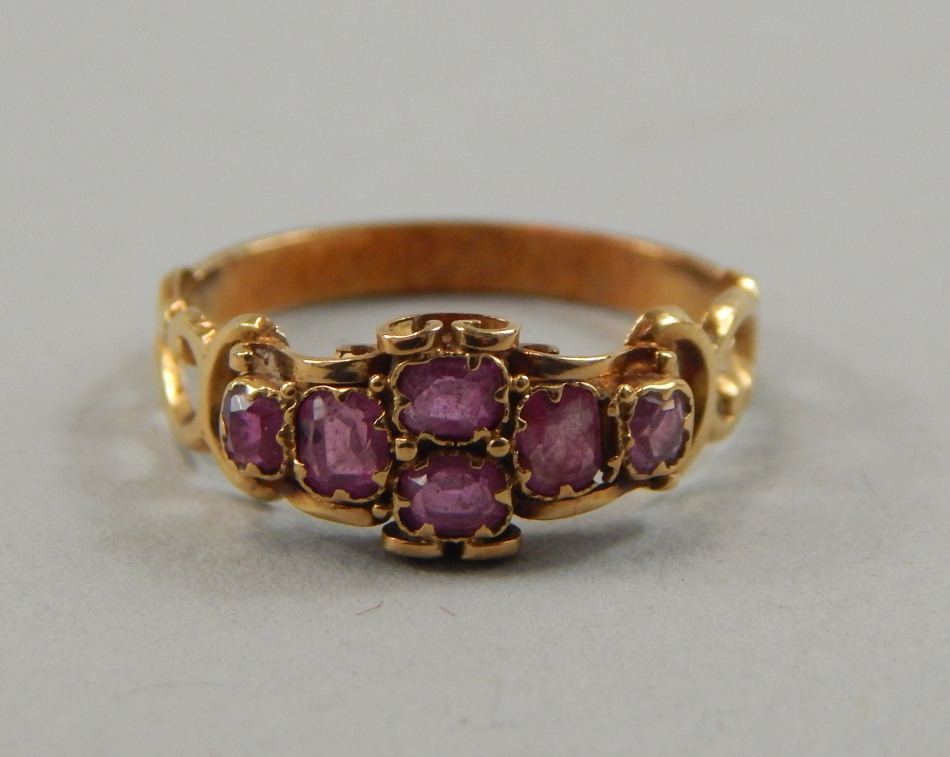 Appraisal: A dress ring set with garnets yellow metal unmarked g