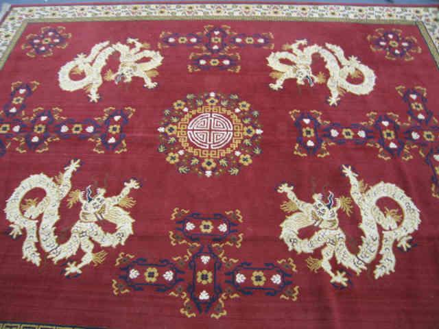 Appraisal: Chinese Style Wool Rug dragon symbol decor on red field