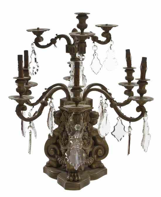 Appraisal: A Pair of Continental Gilt Bronze Nine-Light Candelabra having a