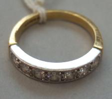 Appraisal: An ct gold and diamond set seven stone half hoop