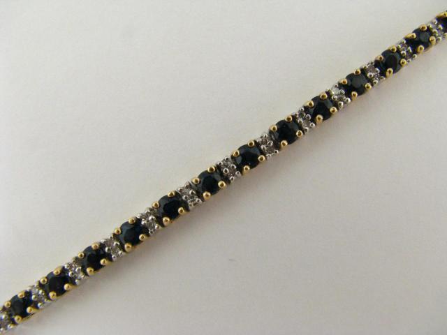 Appraisal: K yellow and white gold sapphire and diamond line bracelet