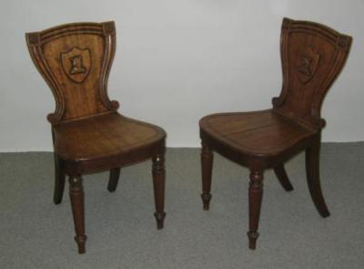 Appraisal: A PAIR OF VICTORIAN OAK HALL CHAIRS the channelled waisted