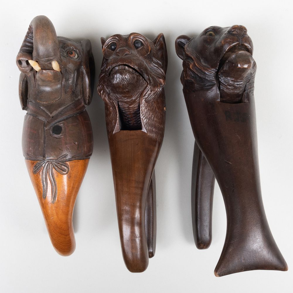 Appraisal: Three Carved and Stained Wood Animal Form Nutcrackers Comprising An