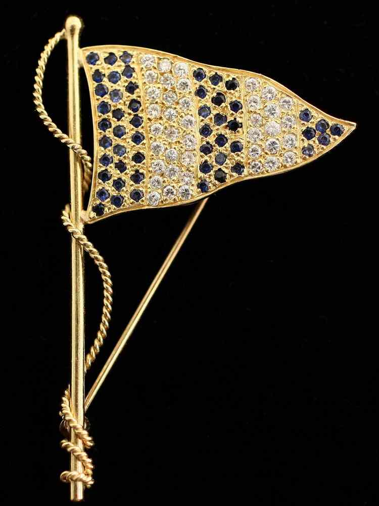 Appraisal: BROOCH - One K yellow gold blue sapphire and diamond