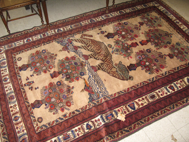 Appraisal: HAND KNOTTED AFGHAN CARPET tiger and vases of flowers design