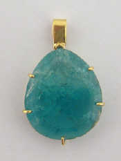 Appraisal: An carat and emerald pendant the pear shaped stone mm