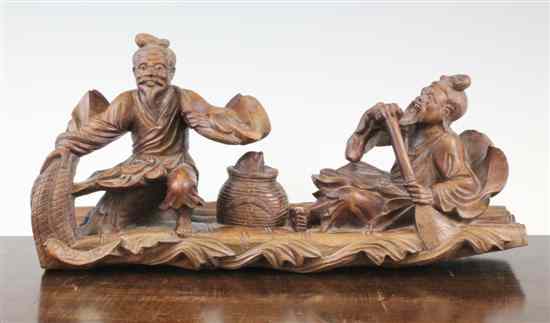 Appraisal: A Chinese carved wood group modelled as two fisherman on