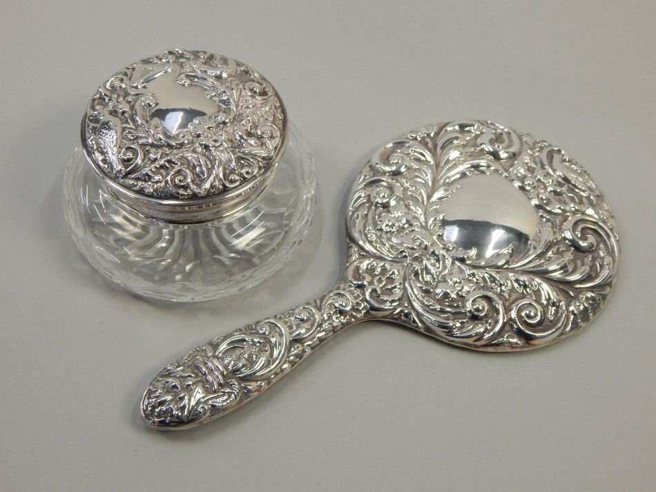 Appraisal: Two silver mounted items dressing table mirror with embossed decoration