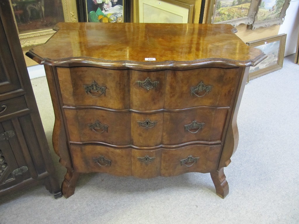 Appraisal: th century style walnut serpentine chest of drawers