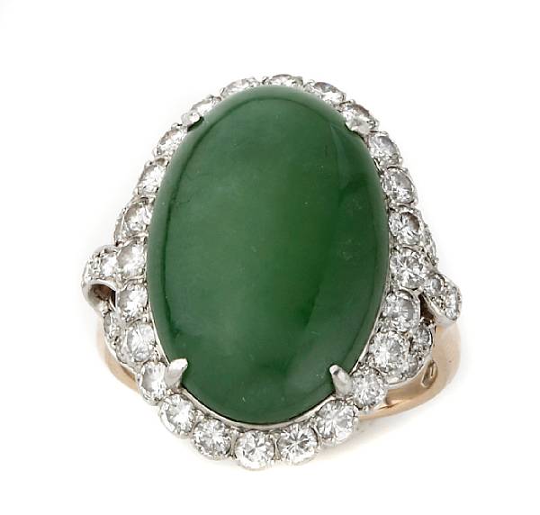 Appraisal: A jade diamond k gold and platinum ring centering an