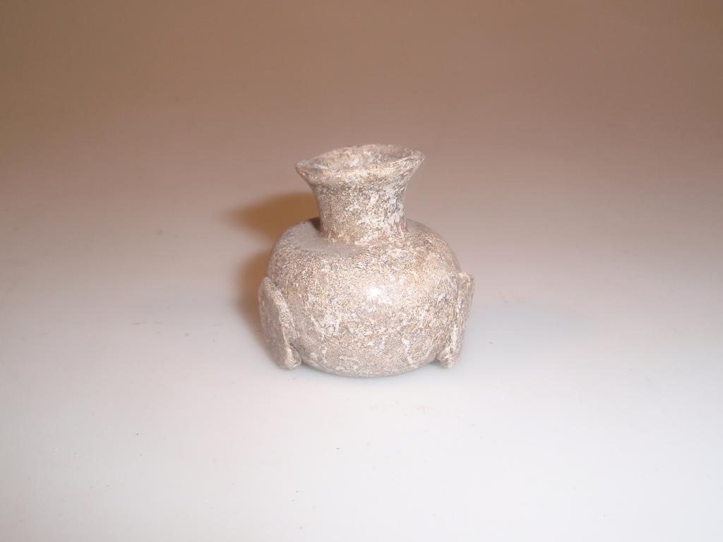 Appraisal: A small post-Roman pale green glass flask with a funnel