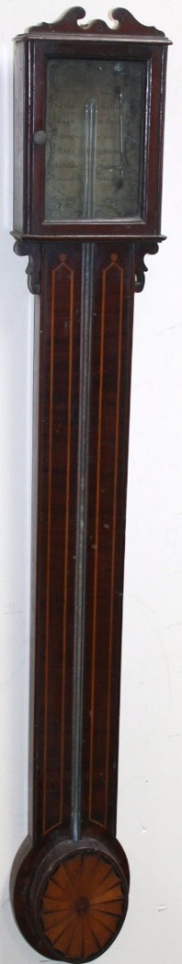 Appraisal: An Edwardian mahogany and boxwood strung stick barometer in a