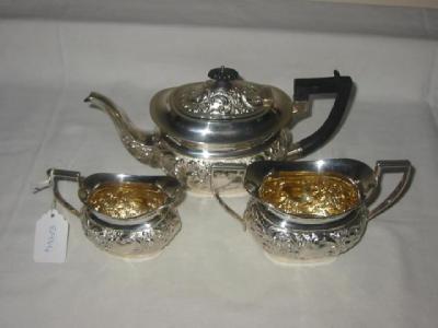 Appraisal: AN EDWARDIAN BACHELOR'S THREE PIECE TEA SET of oval form