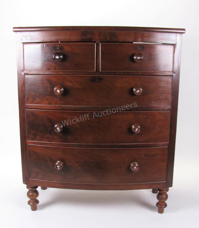 Appraisal: A th century mahogany bowfront chest wood pulls burl mahogany