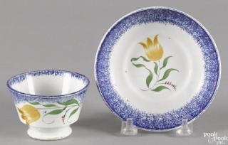 Appraisal: Miniature blue spatter cup and saucer with yellow tulip decoration